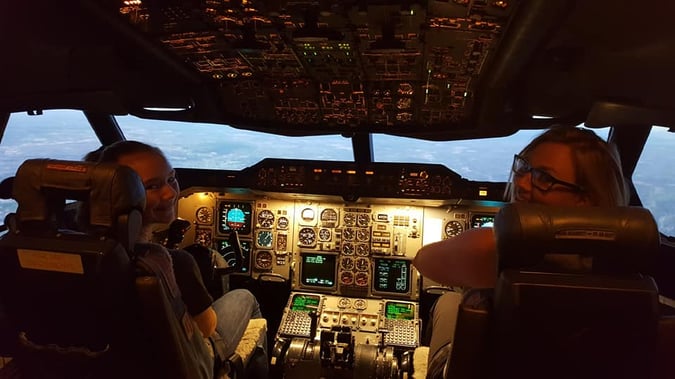 Shawn and daughter in flight simulator